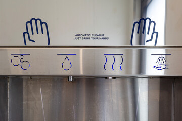A modern device for washing hands using photocells.