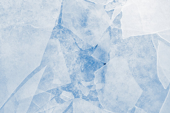 Shards of a crushed thin ice in a light-blue tones. Background texture.