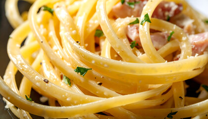 A close-up image of creamy pasta, likely fettuccine Alfredo, topped with chopped parsley. The dish includes mushrooms, bits of ham or bacon, and is coated in a rich white sauce with grated cheese.
