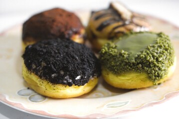 Close-up of assorted donuts with various toppings