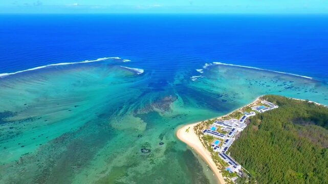 Aerial view of Mauritius island and Le Morne Brabant mountain with beautiful blue lagoon and underwater waterfall illusion background