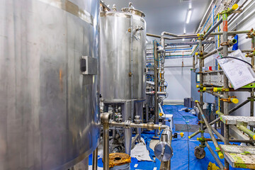 Stainless vertical steel tanks with equipment tank chemical cellar at the with stainless steel tanks cleaning and mixing