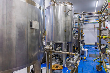 Stainless vertical steel tanks with equipment tank chemical cellar at the with stainless steel tanks cleaning and mixing