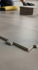 Installing Gray Flooring Tiles.