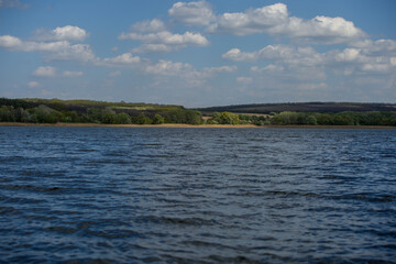 View of Dnieper River with riverbank and sky