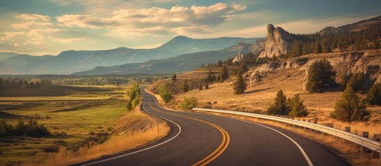 dramatic long winding road through mountainous desert landscape, rocky cliffs on both sides, scenic vista with mountains in the distance, dramatic sky with clouds, cinematic lighting, photorealistic