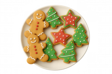 Christmas gingerbread men and decorated tree, star cookies on a white plate, festive holiday baking treats
