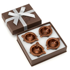 Diwali gift set of ornate copper diyas in a decorative box, perfect for festive celebrations
