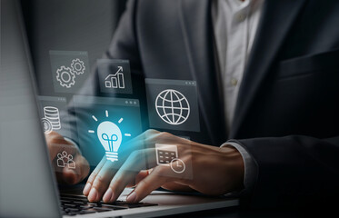 Business Strategy Icons in Digital Planning Interface, Laptop surrounded by glowing icons for innovation and teamwork