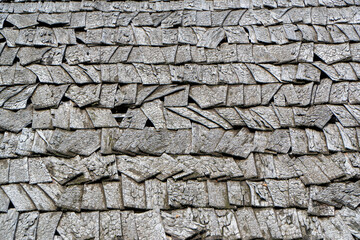 Old wooden roof of the house close-up. Background and texture.