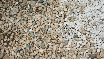 small pebbles or small river stones, arranged in front of the house, usually for foot therapy, white, brown and black in color
