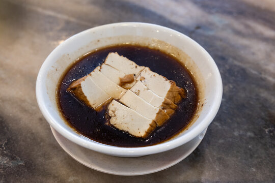 Serving of tofu in gravy, is simple and popular teochew porridge dish in Malaysia