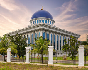Grand State Legislative Council building with a prominent blue dome, white facade, and arched...