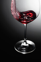 Closeup of red wine pouring.