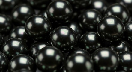 Close up of many black shiny pearls. Luxury beautiful jewelry background texture. Natural organic gemstone for fashion and design concept.
