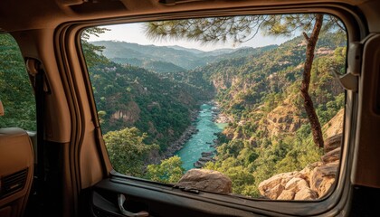 Mountain valley vista through car window