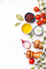 Eat healthy, cook delicious. Food background, spices, basil, rosemary, tomato - ingredients for healthy eating and cooking, white copy space, top view