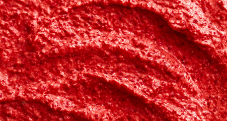 Red berry yogurt ice cream. Fresh fruit smoothie with strawberries, raspberries, pomegranate and red currants. Ice cream texture. Delicious sweet dessert close-up as a background.