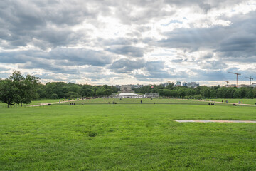 Wide view of the National Mall looking west toward the Lincoln Memorial under a cloudy sky.