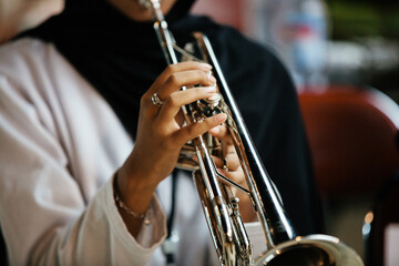 Close Up of Musician Playing Silver Trumpet on rehearsal studio 