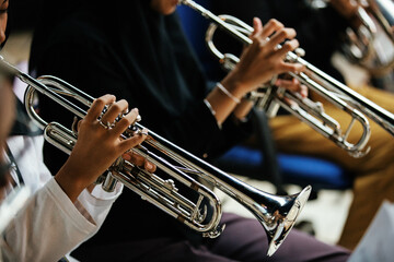 Close Up of Musician Playing Silver Trumpet on rehearsal studio 