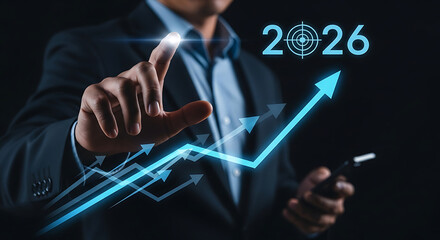 Business growth forecast 2026, businessman pointing at rising graph with target goal, financial success, investment strategy, and futuristic business technology concept