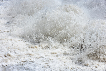 Turbulent water splashing in sunny outdoor setting