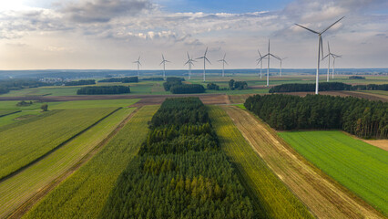 Aerial View of Wind Turbines in Countryside with Fields and Trees