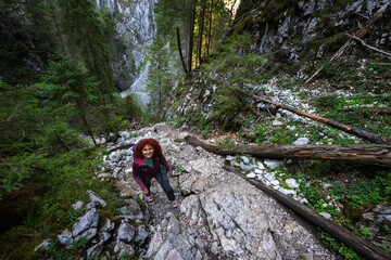 Hiker woman climbing mountain trail