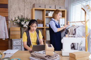Tailor clothing small business partner teamwork, packaging, delivery shipping preparation, Asian women entrepreneurs receive online order, manage products for holiday retail sale, e-commerce logistic
