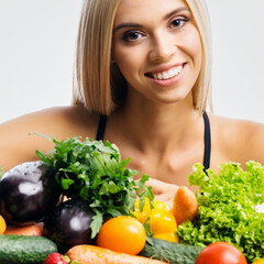 Portrait image of happy smiling young beautiful woman girl with healthy vegetarian food, isolate grey gray background. Diet, loss weight, healthy eating concept. Square