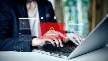 Cybersecurity concept with hacker attack alert on laptop screen, warning system hacked, data...