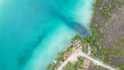Bacalar, Mexico, Quintana Roo, Beautiful blue ocean with a small village on the shore