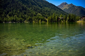 High resolution color image of the peaceful lake of Champex Lac Switzerland with green water and...