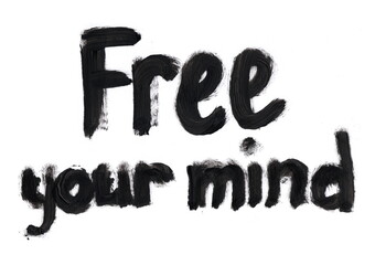 An inscription written in thick black paint with broad brushstrokes on a white background. The text reads, "Free your mind"—the words are vivid and expressive, written in a burst of inspiration.