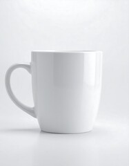 Obraz premium Clean white ceramic mug ready for your custom design, perfect for branding, coffee, tea, or showcasing your creative artwork in a modern studio