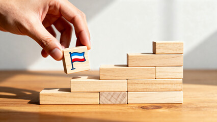 Hand Placing Flag on Wooden Steps