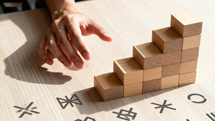 Hand Reaching for Wooden Blocks