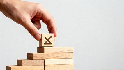 Hand Placing X Block on Stairs