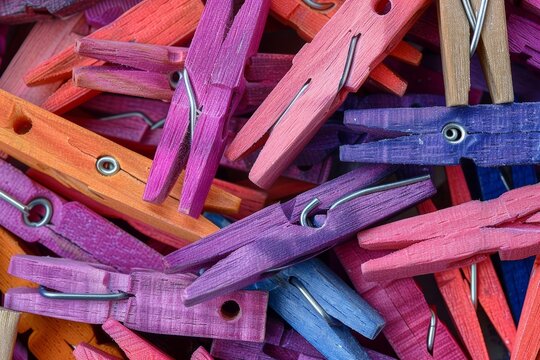 Variety of colorful clothespins in unique shapes  a close up exploration of laundry essentials