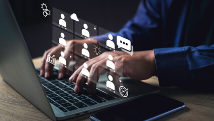 Remote team collaboration concept with businessman typing on laptop and digital interface icons, symbolizing virtual teamwork, online communication, productivity tools, and global workforce