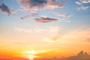 Fototapeta premium Beautiful , luxury soft gradient orange gold clouds and sunlight on the blue sky perfect for the background, take in evening,Twilight, Large size, high definition landscape photo