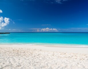 Fototapeta premium white sandy beach on background of turquoise ocean and blue sky