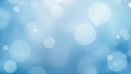 Obraz premium Blue and white blurred bokeh effect creates a soft, dreamy background.