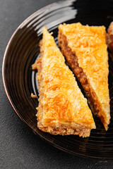 Baklava with pistachios and almonds dessert oriental sweets natural product tasty snack fresh delicious gourmet food background on the table rustic top view copy space