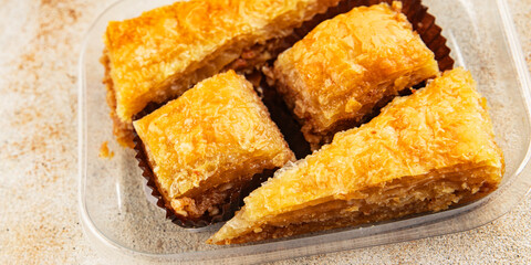 Baklava with pistachios and almonds dessert oriental sweets natural product tasty snack fresh delicious gourmet food background on the table rustic top view copy space