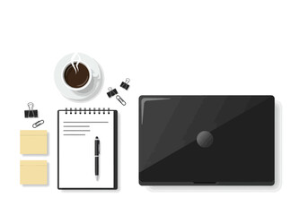 A desk view from above showcases a laptop notebook coffee clips sticky notes and a pen