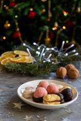 Festive Christmas cookies on a plate with holiday decorations