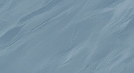 Obraz premium A blue and white abstract pattern with a wave-like texture.