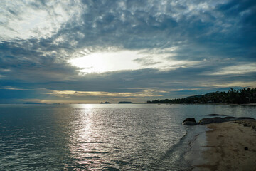 Panoramic beach landscape in Thailand. Inspire tropical beach seascape horizon. Sunset sky calmness tranquil relaxing sunlight summer mood with sparkling ocean, light sand, and a blurred horizon.